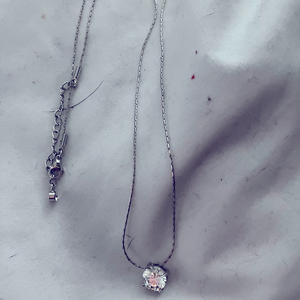 18” silver necklace with a triple A quality cubic zirconia solitaire.